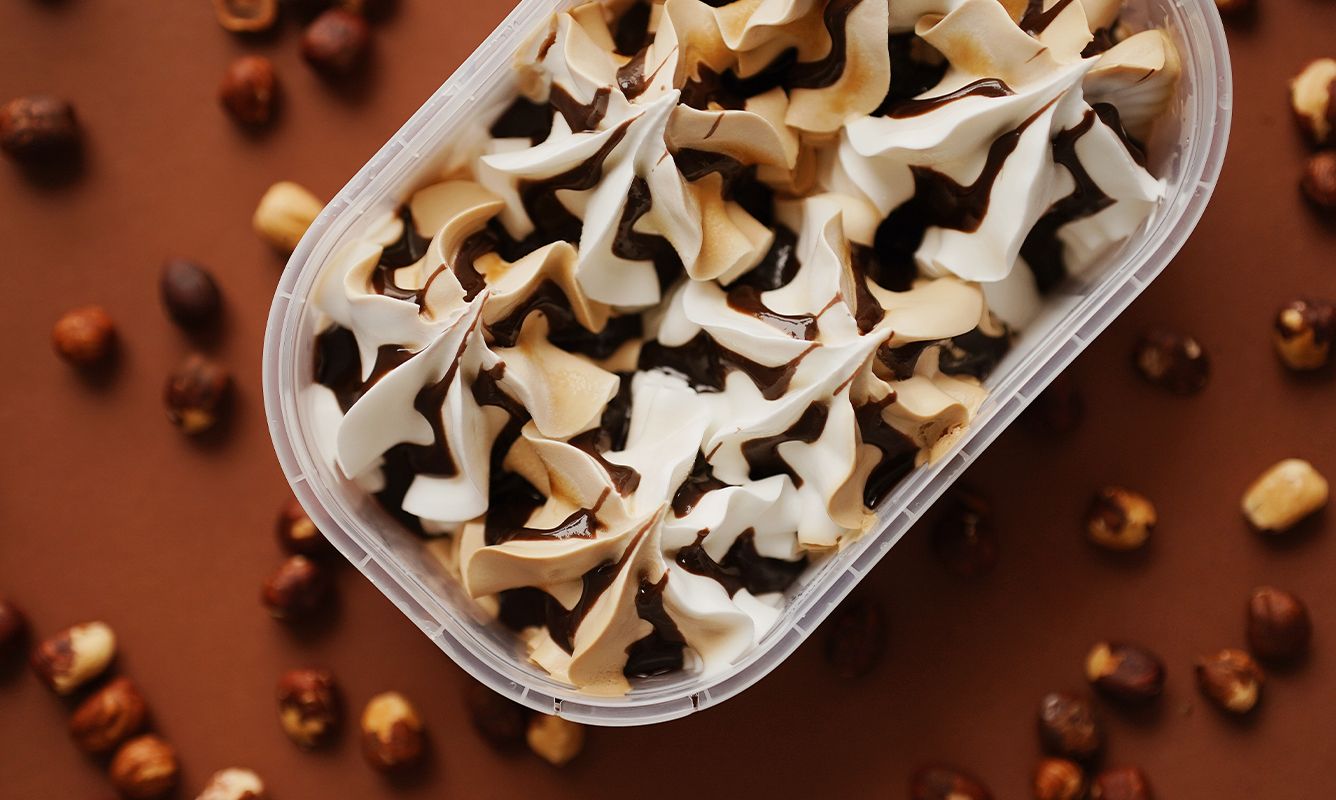 Creamy vanilla and chocolate ice cream with hazelnuts